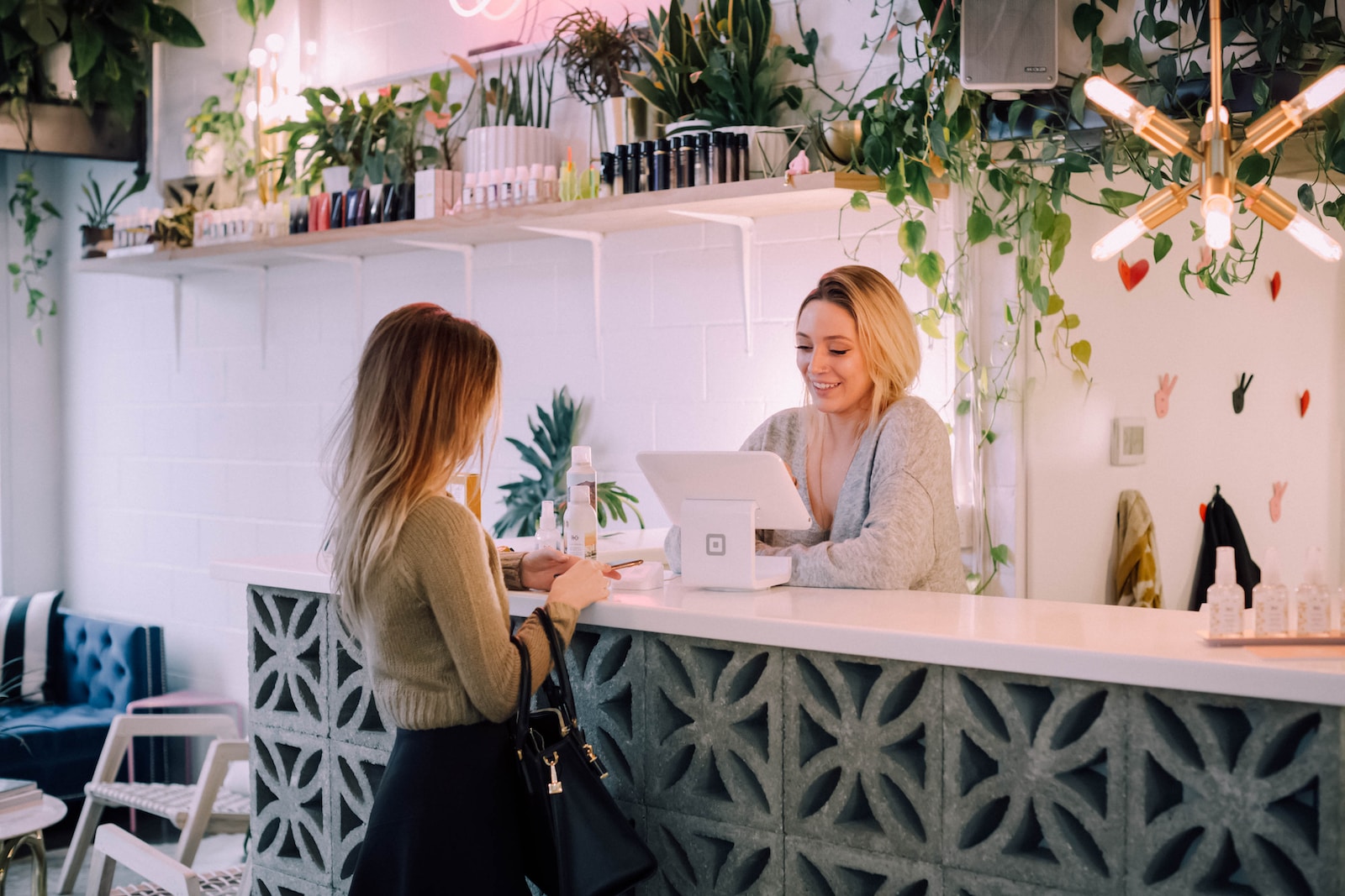 best seasons to buy succulents - woman facing on white counter