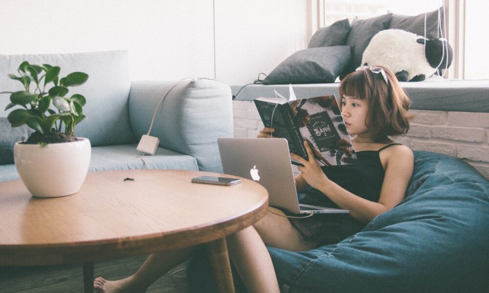 succulent swapping - Woman Sitting on Bean Bag White Using Macbook in Front of Round Table With Green Leafed Plant